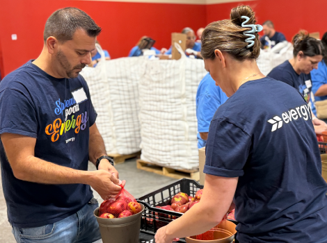 Volunteers prepare food for community distribution